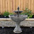 Thumbnail for Giannini Garden Doppia FountainWith Wooden Fence And Green Plants In The Background