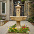 Thumbnail for Giannini Garden Roubaix Concrete Outdoor Fountain For Spouts Surrounded By Flowers With Stone Walls In The Background