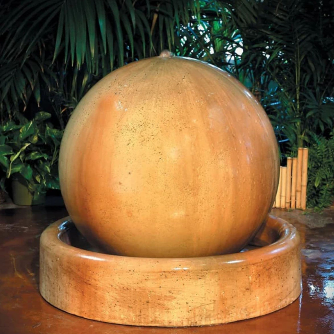 Gist Ball And Ring Base Garden Water Fountain With Green Plants And Bamboo Accent Background