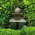 Thumbnail for Gist Double Oblique With Ball Outdoor Water Fountain Surrounded By Green Plants