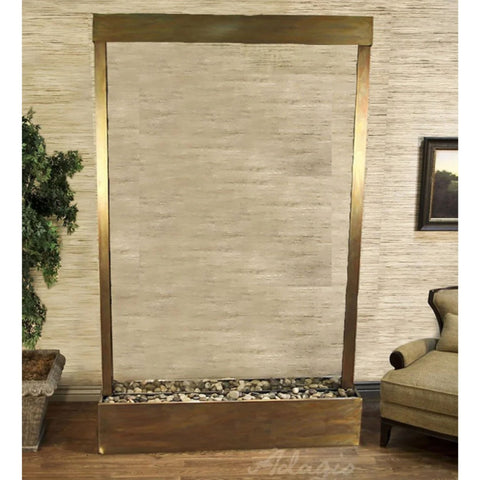 Grandeur River Floor Fountain Center Mounted in Base With Potted Tall Plant And A Fabric Upholstered Chair