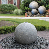 Granite Sphere Stone Fountain With House And Plats In The Background