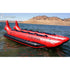 Thumbnail for Island Hopper 10 Person Red Shark Banana Boat Resting In Calm Water With Mountain View