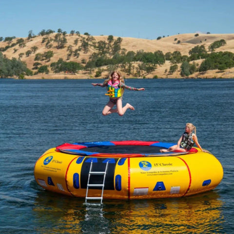 Island Hopper 15 Classic Water Trampoline One Kid Jumping While Other Girl Watching With Mountain View