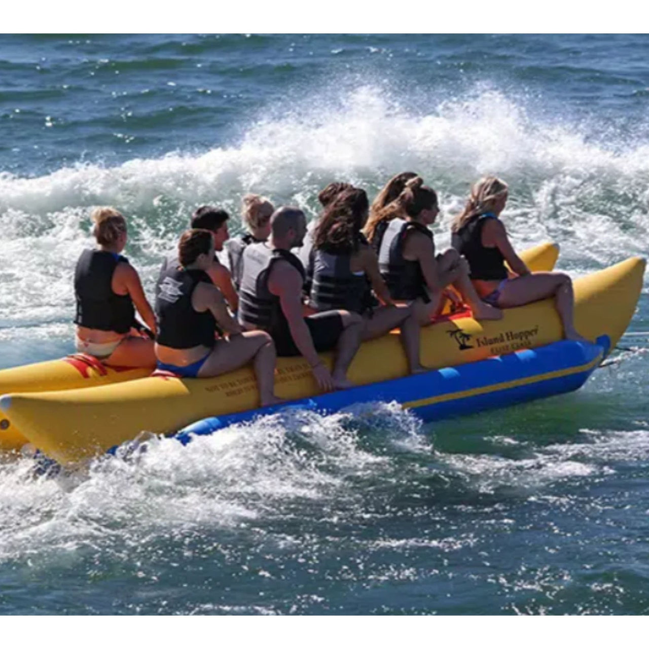 Island Hopper Elite Class 10 Person Banana Boat With A Group Riding Through Waves