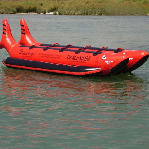 Island Hopper Elite Class Red Shark 10 Person Banana Boat Side View While Resting In Calm Water