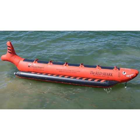 Island Hopper Elite Class Red Shark 6 Person Banana Boat Side View Resting In Calm Water