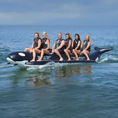 Island Hopper Elite Class Whale Ride 6 Person Banana Boat With Smiling Riders Having Fun On The Deep Ocean