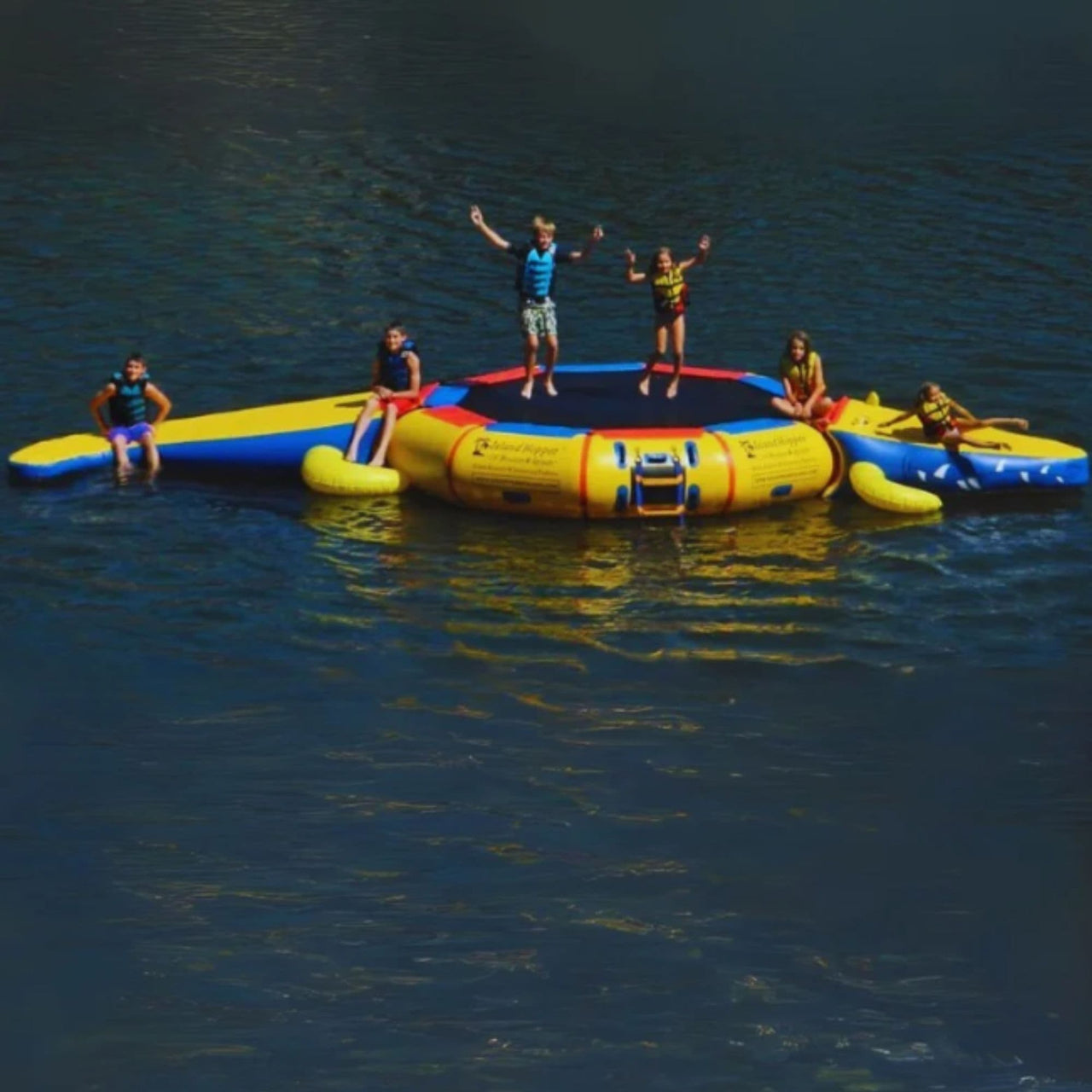 Island Hopper Gator 13 Water Park Kids Having Fun On Water Trampoline In Calm Water