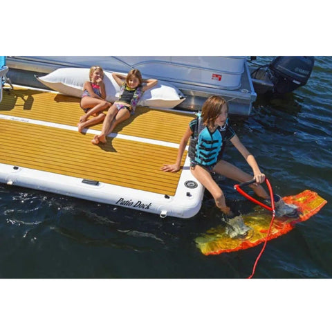 Island Hopper Inflatable Dock With Kids Relaxing And Wakeboarding Beside