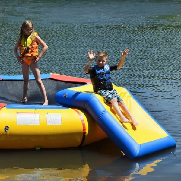 Island Hopper Water Bouncer Slide Attachment With Boy Sliding Down And With Girl Standing Nearby