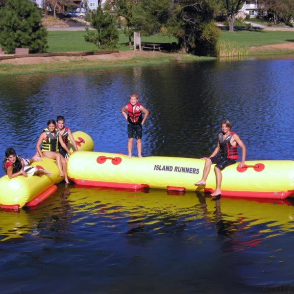 Island Runner Attachment Floating On Calm Lake With Children Having Fun With Green Scenery Background