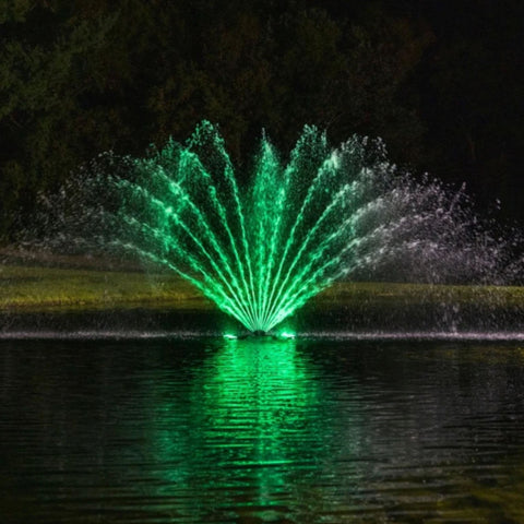 Kasco Fern Premium Fountain Nozzle Beneath A Dark Night Sky With Vibrant Green Reflections On Calm Water