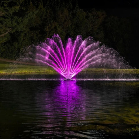 Kasco Fern Premium Fountain Nozzle Beneath A Dark Night Sky With Vibrant Pink Reflections On Calm Water