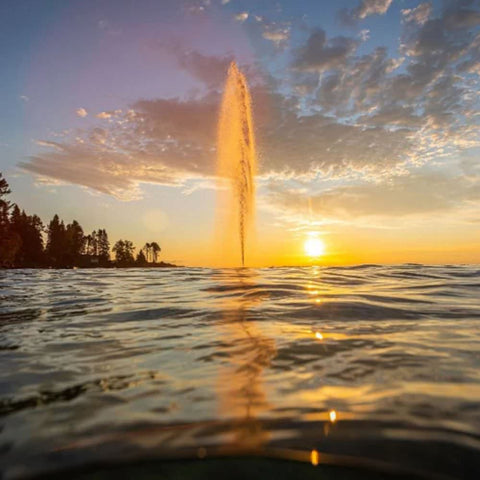Kasco J Series Fountain On The Water At Sunset With Trees In The Background