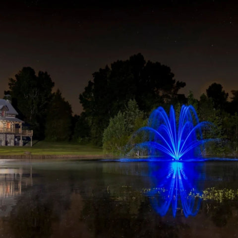 Kasco Mighty Oak Premium Fountain Nozzle Beneath A Dark Night Sky With Vibrant Blue Reflections In A Peaceful Nighttime Setting