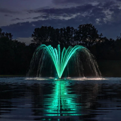 Kasco Palm Premium Fountain Nozzle Scenic Wide View Of A Green-Illuminated Pond Fountain Reflected On A Calm Lake At Night