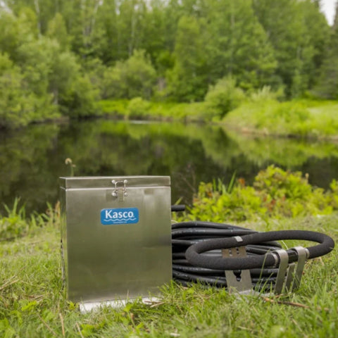Kasco Small Pond Aerator Complete System Positioned Beside A Grassy Pond
