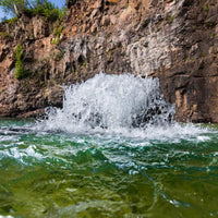 Thumbnail for Kasco Surface Aerator On The Water With A Cliff Face In The Background