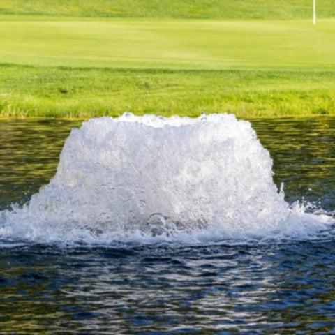Kasco Surface Aerator On The Water With A Golf Green In The Background