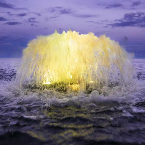 Kasco Surface Aerator With Yellow Lights On The Water