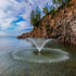 Thumbnail for Kasco VFX Aerating Fountain On The Water With A Cliff In The Background