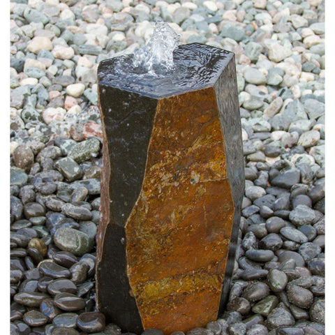 Kazan Stone Outdoor Fountain Surrounded By Pebbles Or Stones