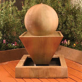 Large Oblique Outdoor Fountain with Ball With Bushes In The Background