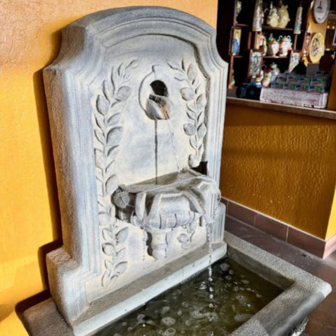 Lemon Lavabo Wall Fountain With Yellow Paint Wall Background