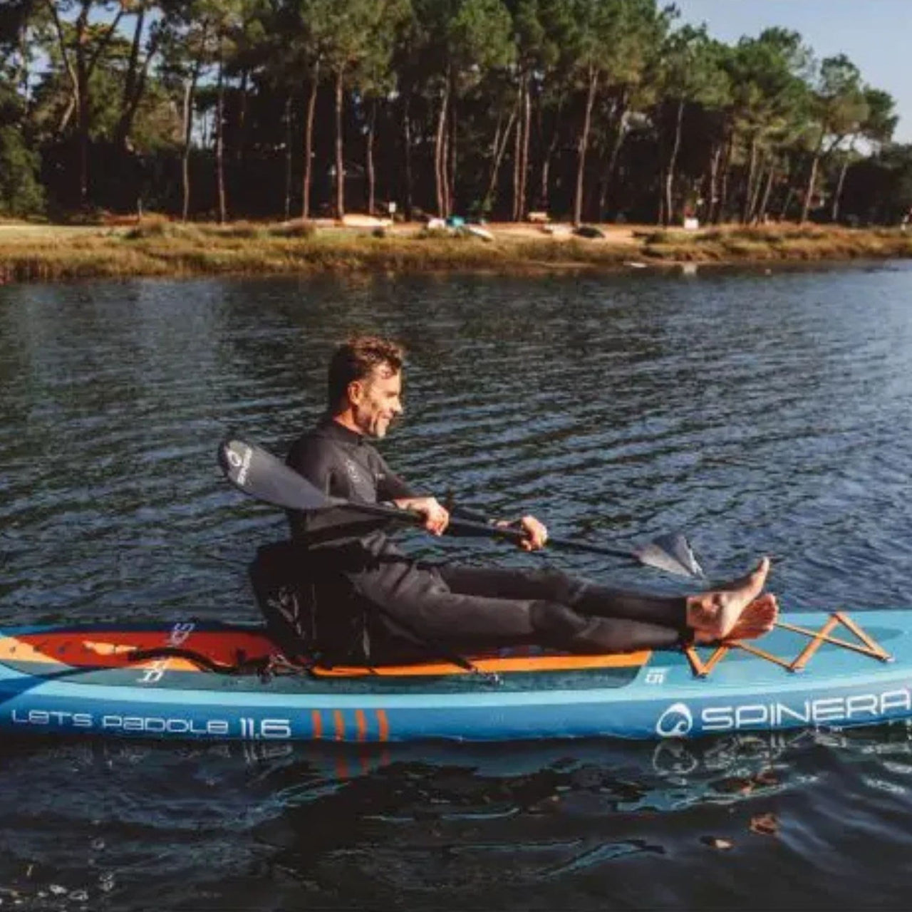 Lets Paddle 11 6 Paddle Board With A Man Ready to Paddle on Calm Water