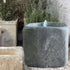 Thumbnail for Limestone Bubbler Fountain With Grass And Plants In The Background