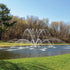 Thumbnail for Magnolia Premium Fountain Nozzle Beneath A Clear Blue Sky And Surrounded By Trees