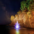 Thumbnail for Mahogany Premium Fountain Nozzle Against A Rocky Cliff With Reflections At Night