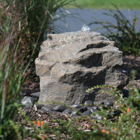 Mini Mountain Spring Stone Garden Fountain Surrounded By Ornamental Plants