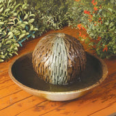 Mini Rubix Garden Water Fountain By Gist With Plants And Flowers In The Background