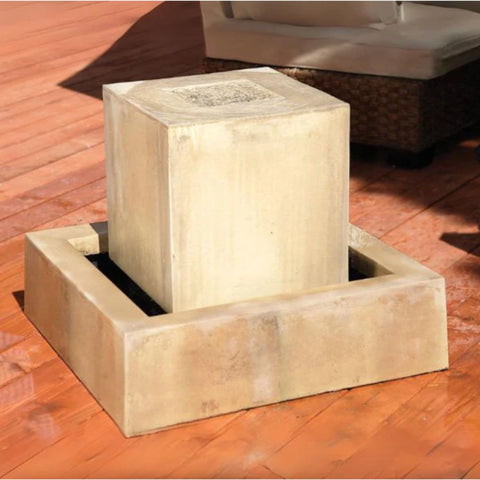 Minimalist Square Block Garden Water Feature With Wicker Sofa And Wooden Floor