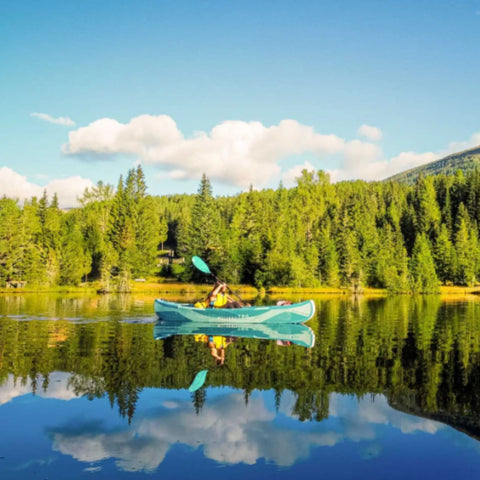Molveno 380 Kayak With A Man Paddling Calmly On A Green Lake