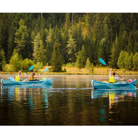 Molveno 380 With People Paddling On Calm Lake Surrounded By Green Forests