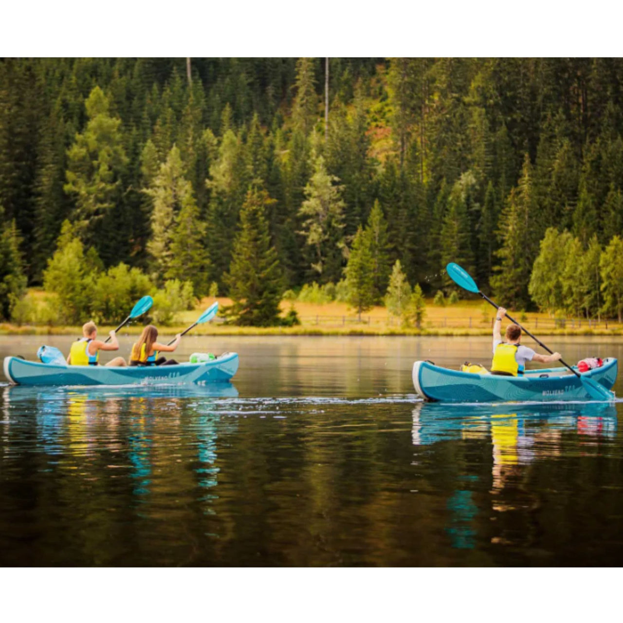 Molveno 380 With People Paddling On Calm Lake Surrounded By Green Forests