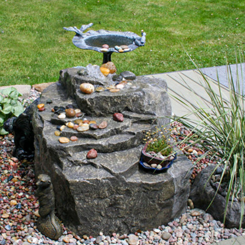 Mountain Spring Rock Outdoor Fountain With Birdbath, Green Grass And Plants