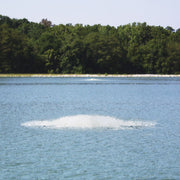 OWS Air-O-Lator Aquarian Quantum Surface Aerator On The Water With Trees In The Background