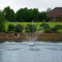 Thumbnail for Outdoor Water Solutions EcoSeries Floating Pond Fountain On The Water With Trees In The Background