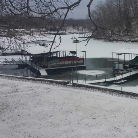 Outdoor Water Solutions Ice-Away Pond De-Icer On The Water Near A Boat Dock
