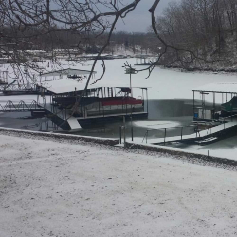 Outdoor Water Solutions Ice-Away Pond De-Icer On The Water Near A Boat Dock