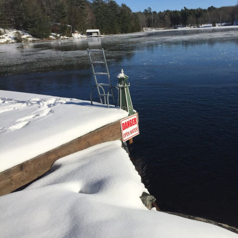 Outdoor Water Solutions Ice-Away Pond De-Icer On The Water Near A Pier Ladder
