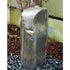 Thumbnail for Outdoor Silver Rock Fountain With Yellow Wall And Pink Flowers Behind