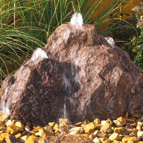 Outdoor Triple Cascade Fountain With Wooden Wall And Green Plants Background
