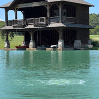 Thumbnail for Outdoor Water Solutions AerMaster Pro Deep Pond Electric Aerator On The Water Bubbling With A House In The Background