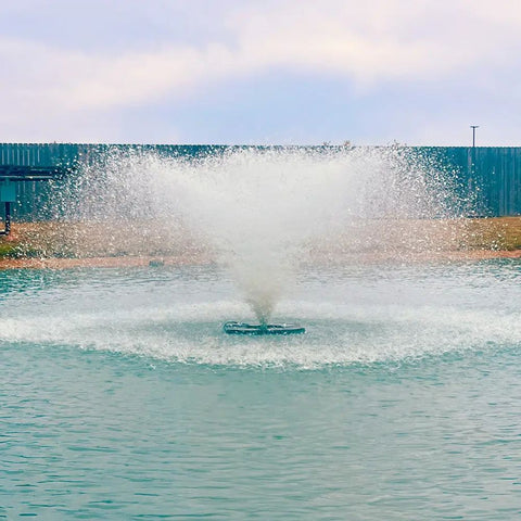 Outdoor Water Solutions Classic Series Electric Pond Aerator Fountain On The Water With A Fence In The Background