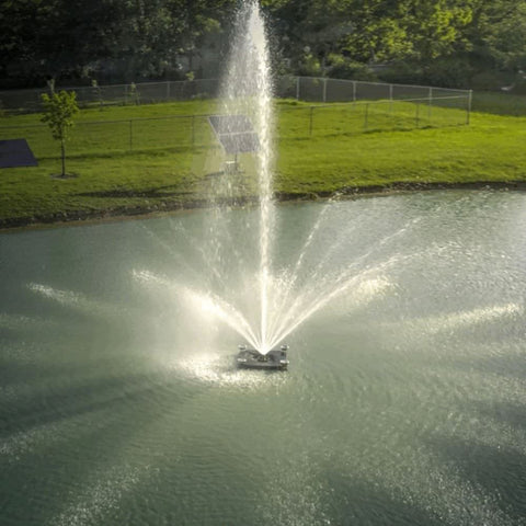 Outdoor Water Solutions Palatial Display Solar Pond Fountain On The Water With A Fence In The Background